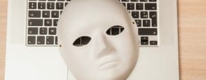 white face mask on laptop keyboard