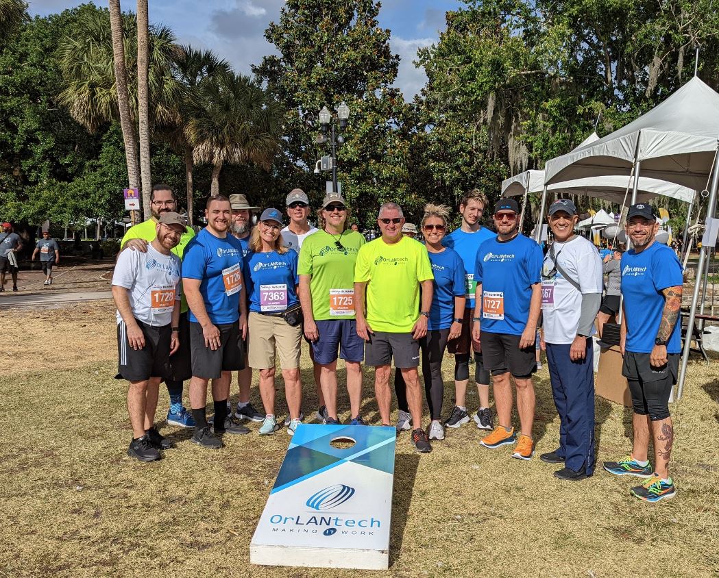 Orlantech team members participating in the IOA 5K race at Lake Eola